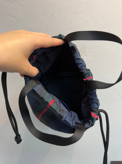 Checked drawstring bag