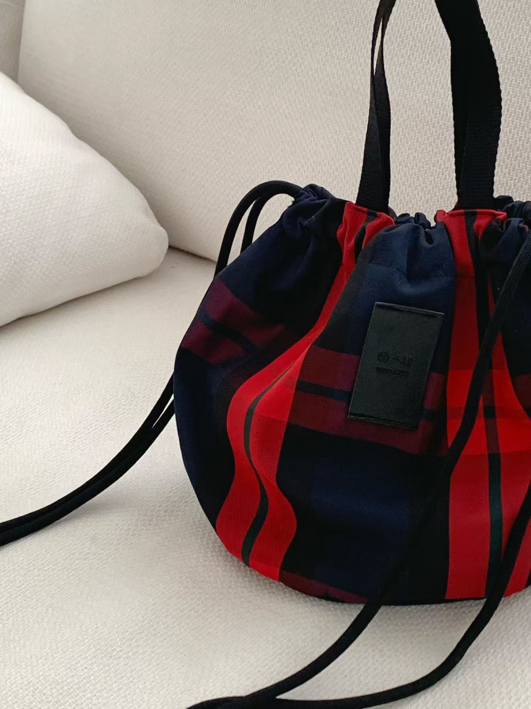 Checked drawstring bag